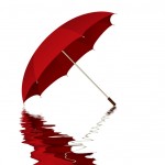 Red umbrella with reflection in water